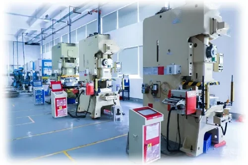A press line: mechanical presses standing in a row along a workshop bay