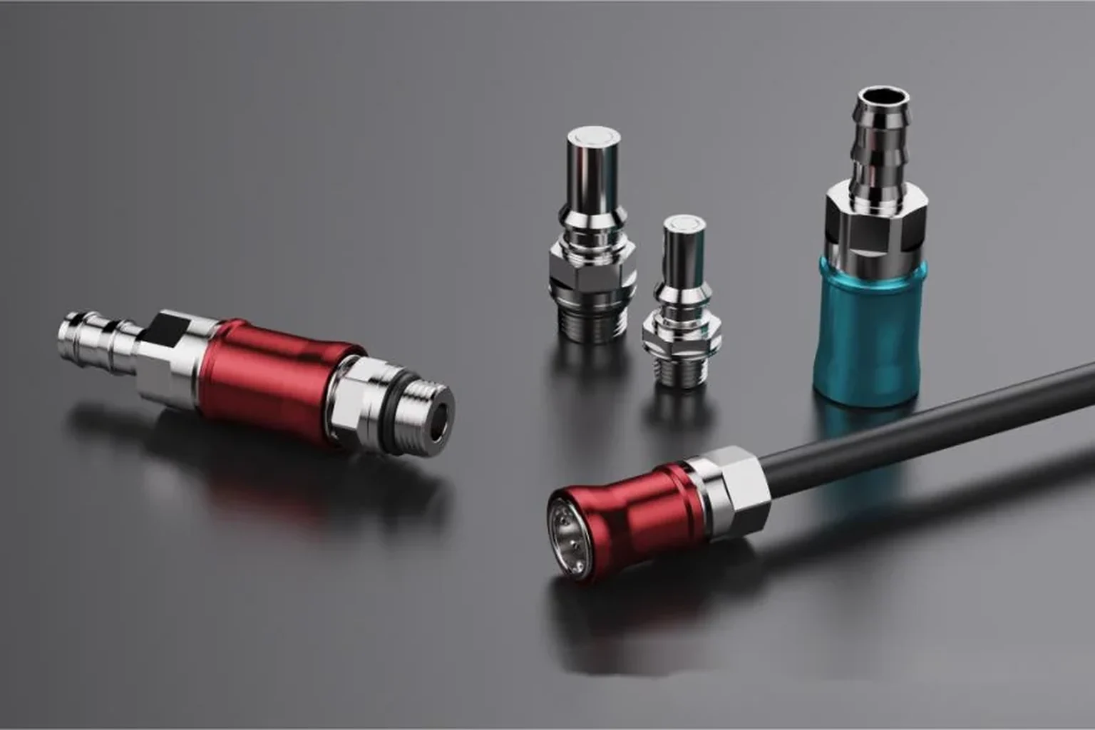 Rendering: five UQD-series couplings with red and cyan anodised rings and chrome bodies on a neutral grey gradient ground